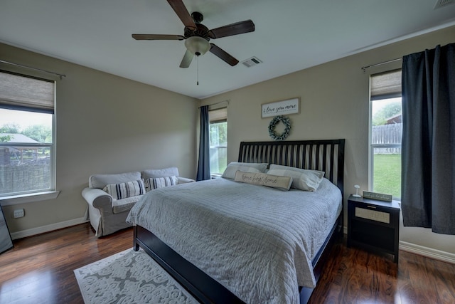 bedroom featuring multiple windows, wood finished floors, and visible vents