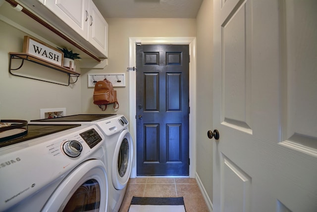 washroom featuring light tile patterned floors, washer and dryer, cabinet space, and baseboards