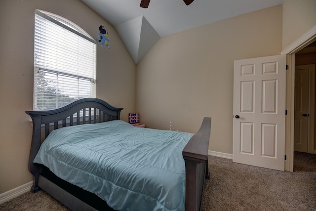 carpeted bedroom featuring ceiling fan, lofted ceiling, and baseboards