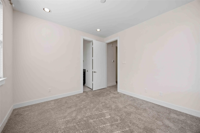 unfurnished room with recessed lighting, carpet flooring, and baseboards