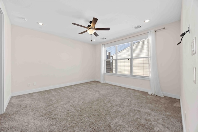 carpeted spare room featuring ceiling fan, baseboards, visible vents, and recessed lighting