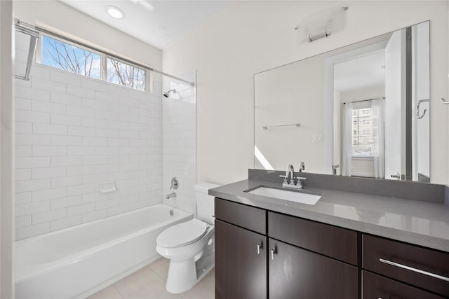 bathroom with shower / bath combination, tile patterned flooring, vanity, and toilet