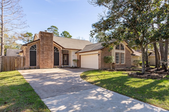 5442 Garden Village Dr, Kingwood, TX 77339 - mid-century modern home featuring a chimney, driveway, fence, a garage, and brick siding