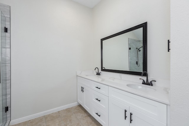 5442 Garden Village Dr, Kingwood, TX 77339 - bathroom with baseboards, a sink, double vanity, and a stall shower