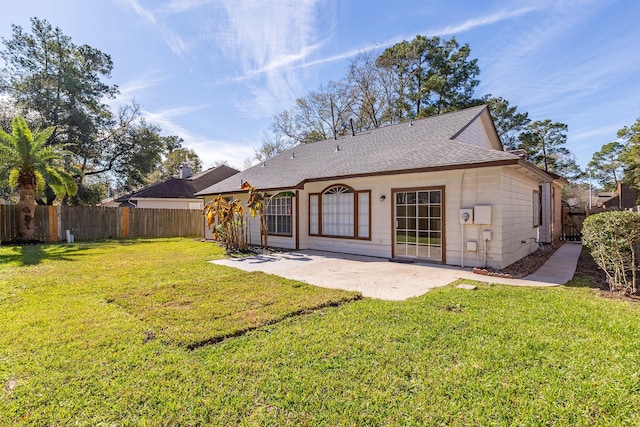 5442 Garden Village Dr, Kingwood, TX 77339 - rear view of house featuring a lawn, a patio area, a fenced backyard, and a shingled roof
