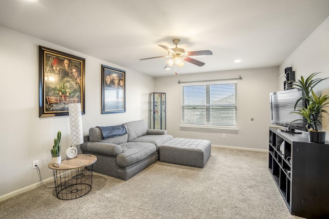 carpeted living area featuring baseboards, a ceiling fan, and recessed lighting