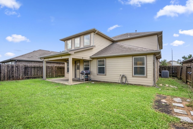 back of property with a patio area, a shingled roof, a fenced backyard, a yard, and cooling unit