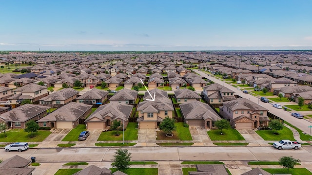 birds eye view of property with a residential view