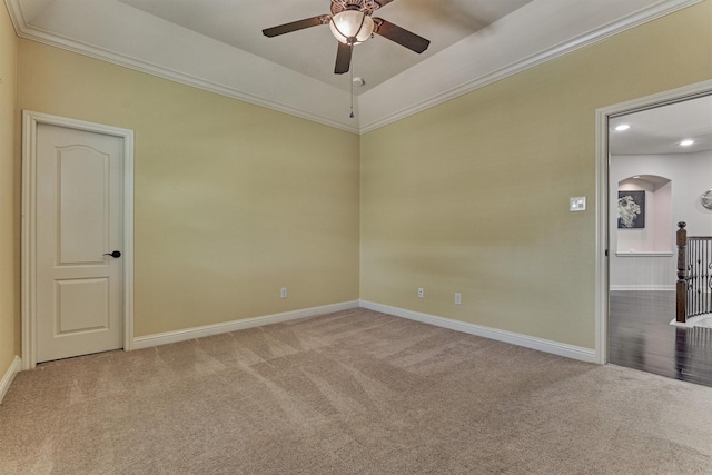 21411 Fairhaven Creek Dr, Cypress, TX 77433 - empty room featuring a ceiling fan, carpet, arched walkways, baseboards, and ornamental molding