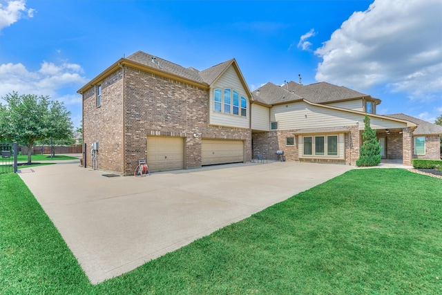 21411 Fairhaven Creek Dr, Cypress, TX 77433 - rear view of house with an attached garage, driveway, and brick siding