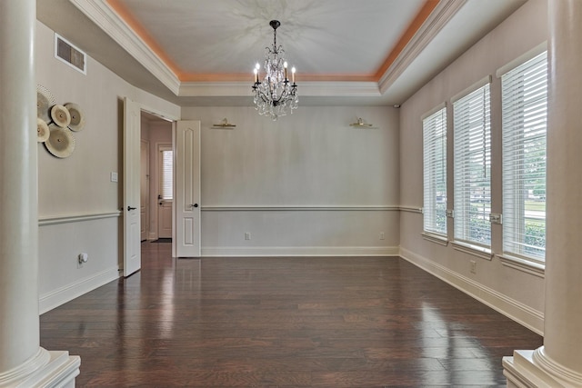 21411 Fairhaven Creek Dr, Cypress, TX 77433 - unfurnished room with a raised ceiling, a chandelier, crown molding, and dark wood finished floors