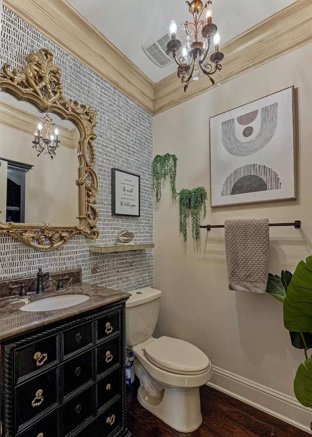 21411 Fairhaven Creek Dr, Cypress, TX 77433 - half bathroom featuring a chandelier, toilet, wood finished floors, vanity, and crown molding