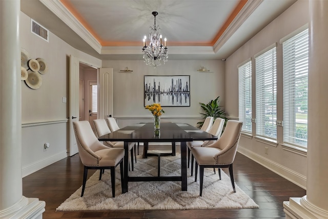 21411 Fairhaven Creek Dr, Cypress, TX 77433 - dining room with a chandelier, a tray ceiling, ornamental molding, baseboards, and dark wood-type flooring