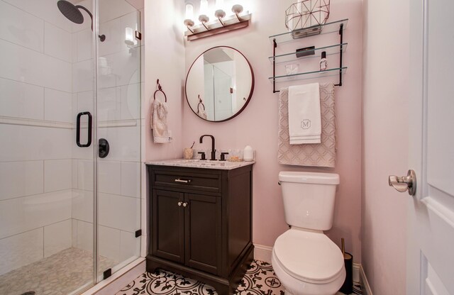 15708 Acapulco Dr, Jersey Village, TX 77040 - bathroom featuring a shower stall, toilet, vanity, and baseboards