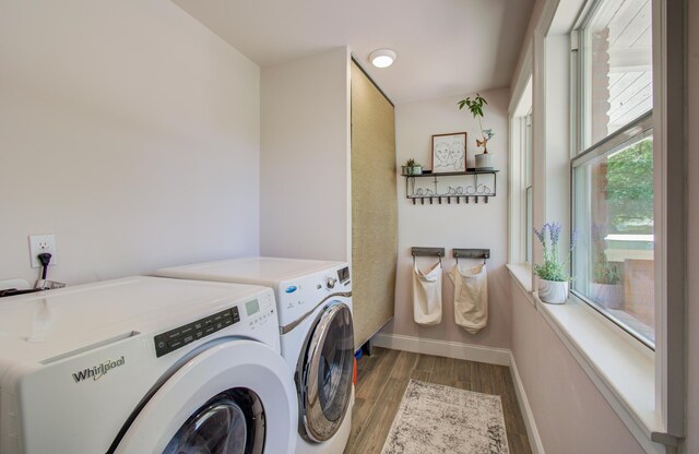 15708 Acapulco Dr, Jersey Village, TX 77040 - clothes washing area with wood finished floors, washer and clothes dryer, baseboards, and laundry area