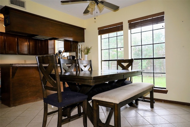 9948 Twin Shores Dr, Willis, TX 77318 - dining area with a ceiling fan, visible vents, a healthy amount of sunlight, and light tile patterned floors