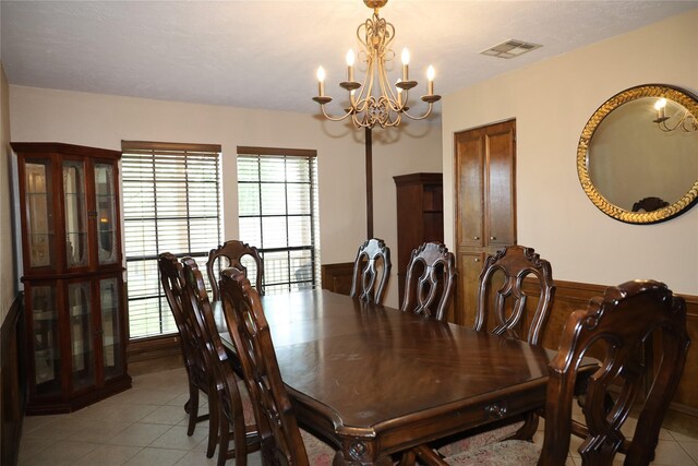 9948 Twin Shores Dr, Willis, TX 77318 - dining room featuring light tile patterned floors, an inviting chandelier, a healthy amount of sunlight, and visible vents