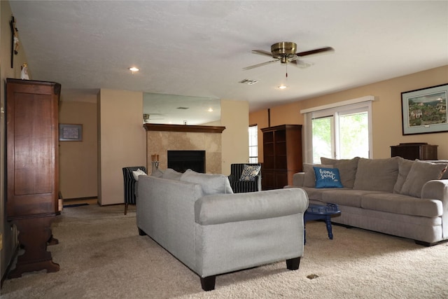 9948 Twin Shores Dr, Willis, TX 77318 - living area with a ceiling fan, visible vents, light colored carpet, a fireplace, and recessed lighting