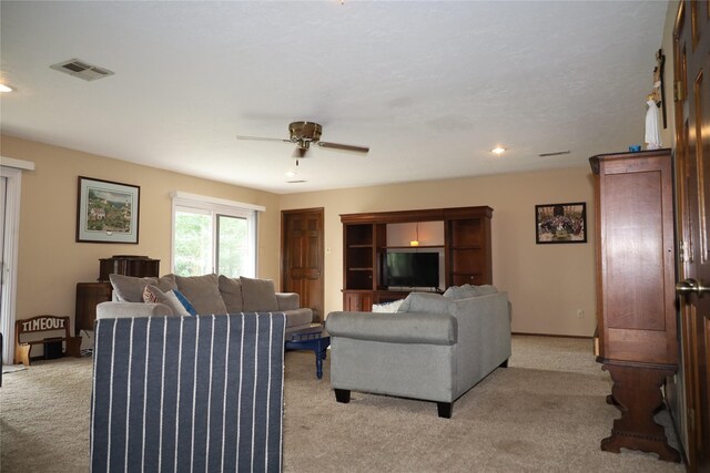 9948 Twin Shores Dr, Willis, TX 77318 - living area featuring ceiling fan, light colored carpet, recessed lighting, and visible vents