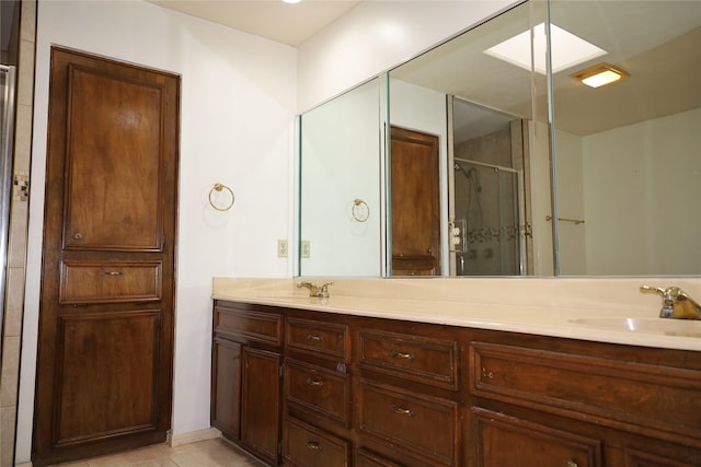 9948 Twin Shores Dr, Willis, TX 77318 - bathroom with a sink, tile patterned floors, a stall shower, and double vanity