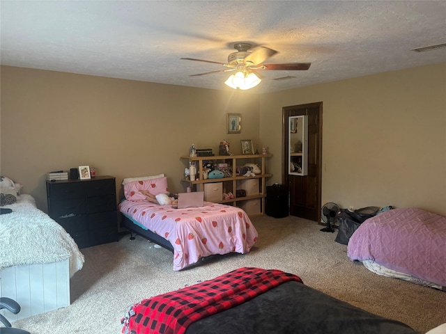 9948 Twin Shores Dr, Willis, TX 77318 - carpeted bedroom featuring ceiling fan and visible vents