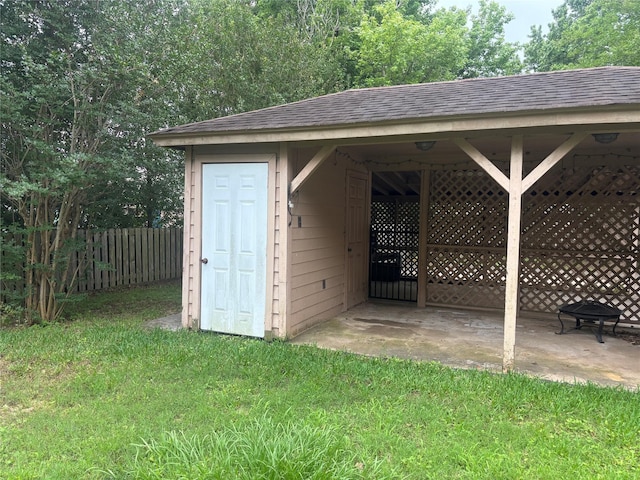 9948 Twin Shores Dr, Willis, TX 77318 - view of outbuilding featuring fence and an outbuilding