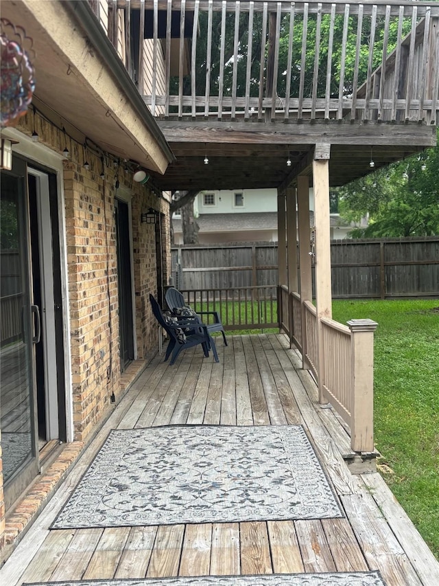 9948 Twin Shores Dr, Willis, TX 77318 - wooden terrace featuring a yard and a fenced backyard