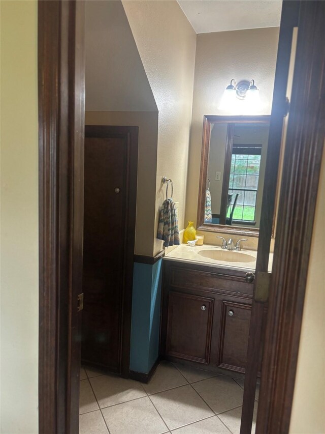 9948 Twin Shores Dr, Willis, TX 77318 - bathroom featuring tile patterned flooring and vanity