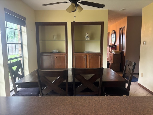 9948 Twin Shores Dr, Willis, TX 77318 - tiled dining area featuring ceiling fan