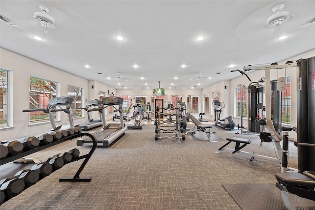 workout area featuring a wealth of natural light, visible vents, and recessed lighting