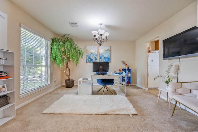5903 Llano Creek Dr, Katy, TX 77449 - office area with carpet, a chandelier, and plenty of natural light