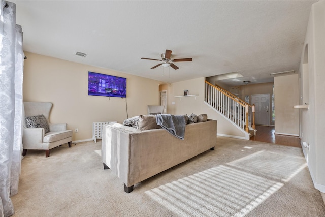 5903 Llano Creek Dr, Katy, TX 77449 - living room featuring stairway, carpet flooring, ceiling fan, and baseboards