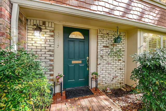 6415 Olympia Dr Unit 143, Houston, TX 77057 - view of exterior entry with brick siding and covered porch