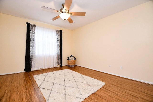 6415 Olympia Dr Unit 143, Houston, TX 77057 - spare room with ceiling fan, baseboards, and wood finished floors