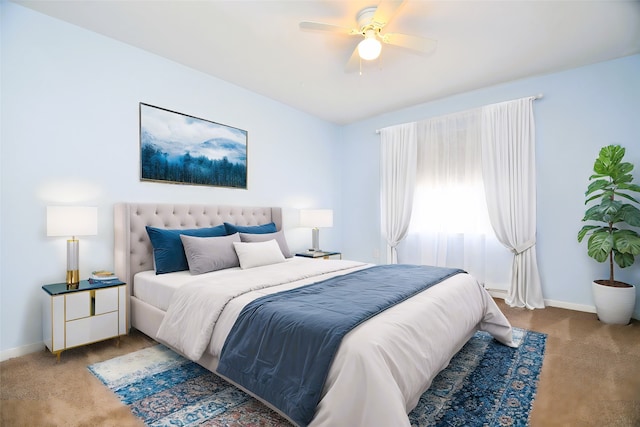 6415 Olympia Dr Unit 143, Houston, TX 77057 - carpeted bedroom featuring a ceiling fan and baseboards