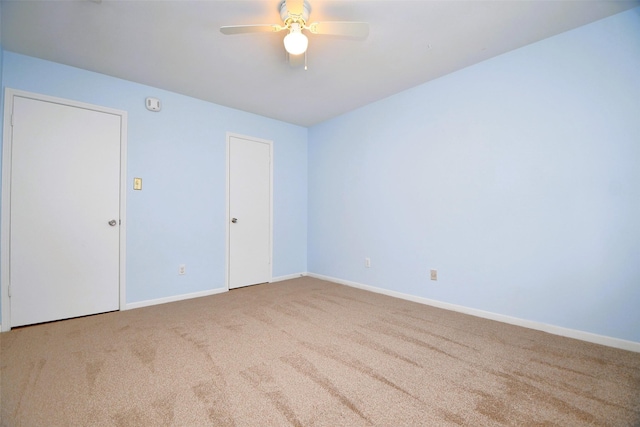 6415 Olympia Dr Unit 143, Houston, TX 77057 - carpeted spare room with baseboards and a ceiling fan