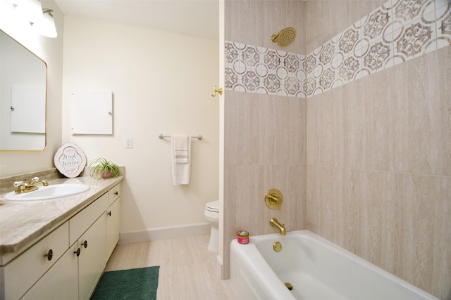 6415 Olympia Dr Unit 143, Houston, TX 77057 - full bath with toilet, baseboards, wood finished floors, washtub / shower combination, and vanity