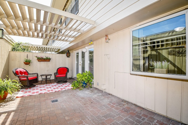 6415 Olympia Dr Unit 143, Houston, TX 77057 - view of patio / terrace featuring a pergola, fence, and french doors