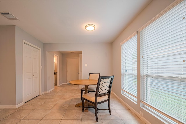 7730 Maple Tree Dr, Houston, TX 77088 - dining area with light tile patterned floors and baseboards