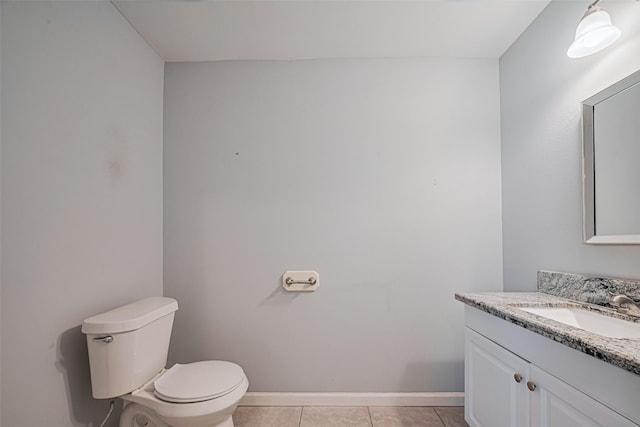 7730 Maple Tree Dr, Houston, TX 77088 - bathroom with toilet, tile patterned floors, vanity, and baseboards