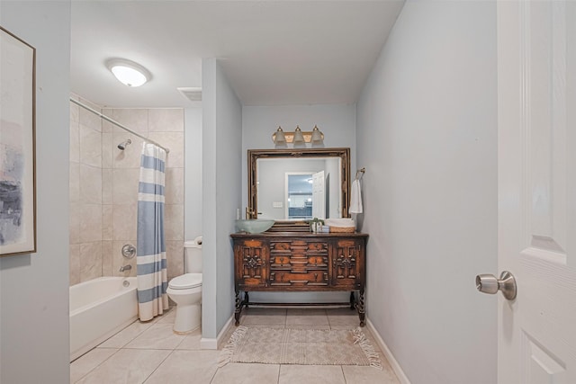 7730 Maple Tree Dr, Houston, TX 77088 - bathroom featuring tile patterned floors, toilet, shower / tub combo, vanity, and baseboards