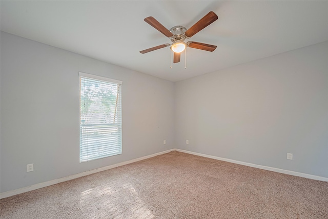 7730 Maple Tree Dr, Houston, TX 77088 - carpeted empty room featuring a ceiling fan and baseboards