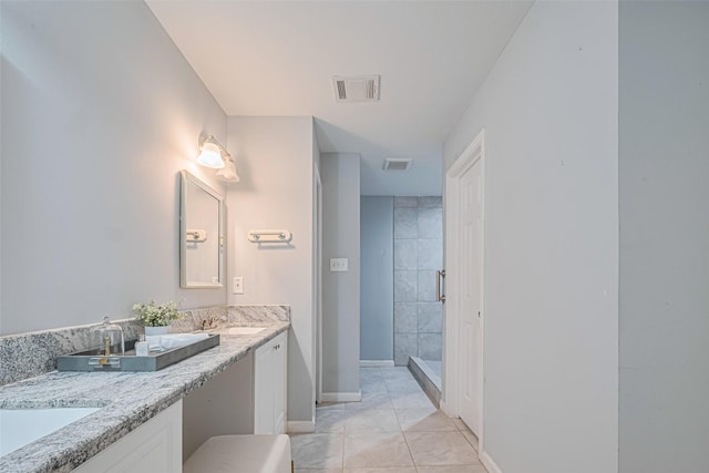 7730 Maple Tree Dr, Houston, TX 77088 - full bath with a stall shower, double vanity, and baseboards