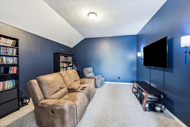 living room with baseboards, carpet, and a textured ceiling