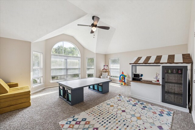 game room with carpet flooring, ceiling fan, baseboards, and lofted ceiling