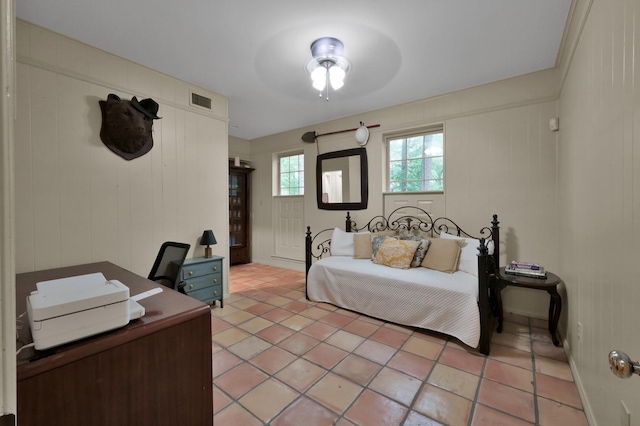 bedroom featuring light tile patterned floors and visible vents