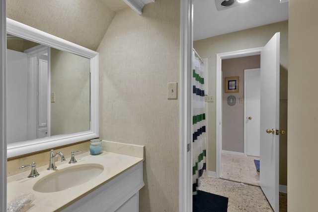 bathroom with vanity and baseboards