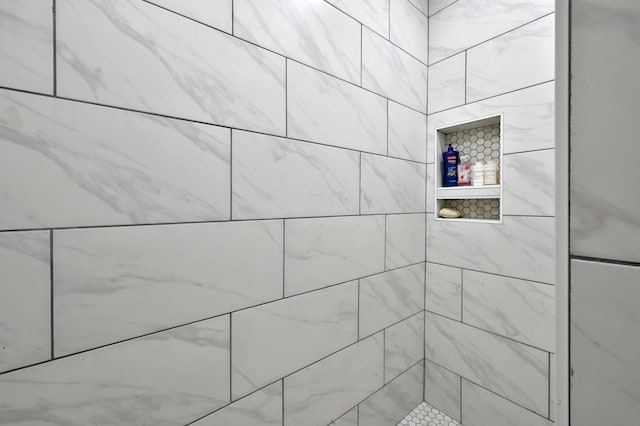 full bathroom with tiled shower
