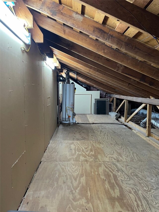 unfinished attic with gas water heater