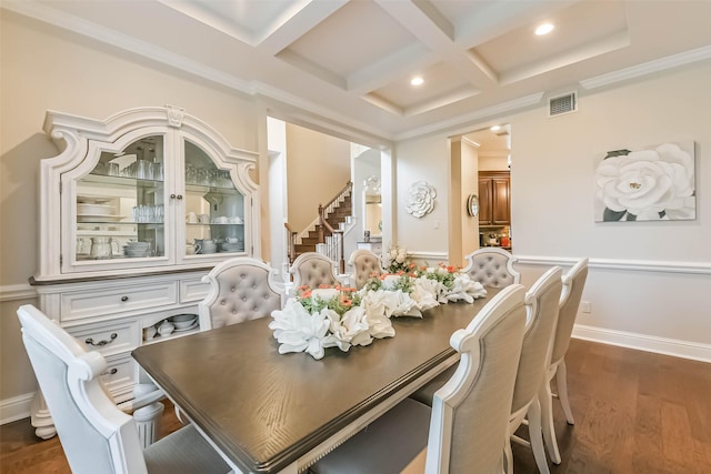 dining area featuring beamed ceiling, dark wood-type flooring, crown molding, coffered ceiling, and visible vents